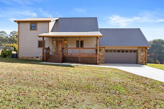 view of front of property with a porch, a front lawn, and a garage