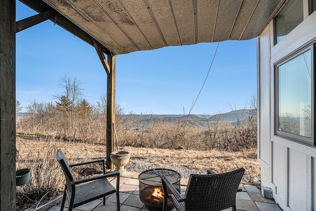 view of patio / terrace with a fire pit