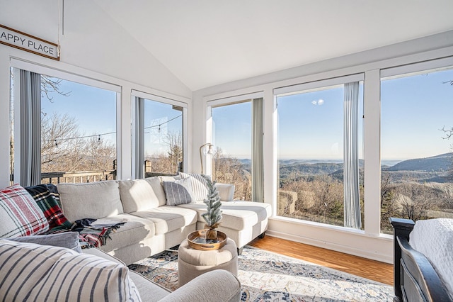 sunroom featuring lofted ceiling