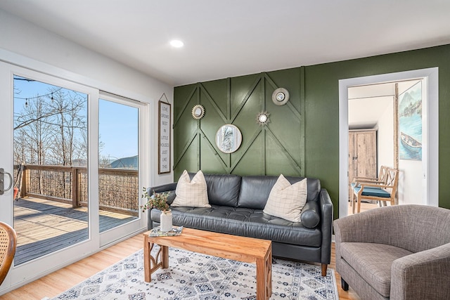 living room with hardwood / wood-style flooring and a healthy amount of sunlight