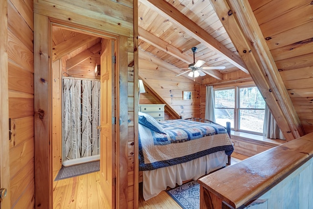 bedroom featuring wood ceiling, wood walls, hardwood / wood-style floors, and vaulted ceiling with beams