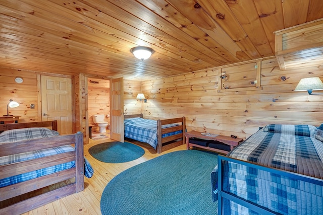 bedroom featuring wood ceiling, wood finished floors, and wood walls