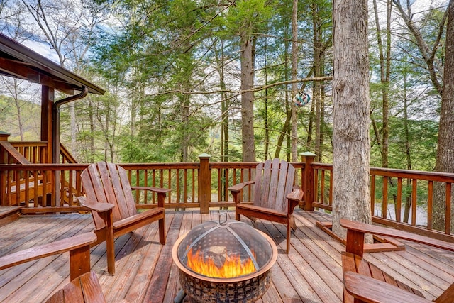 wooden deck with an outdoor fire pit
