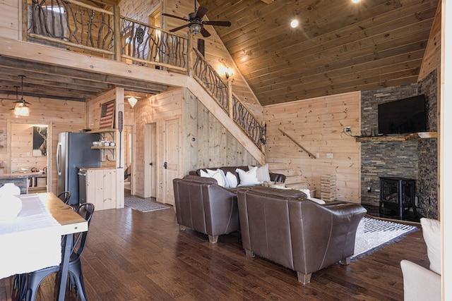 150 Laurel Trce, Blue Ridge, GA 30513 - living area featuring high vaulted ceiling, wooden walls, ceiling fan, wood-type flooring, and a fireplace
