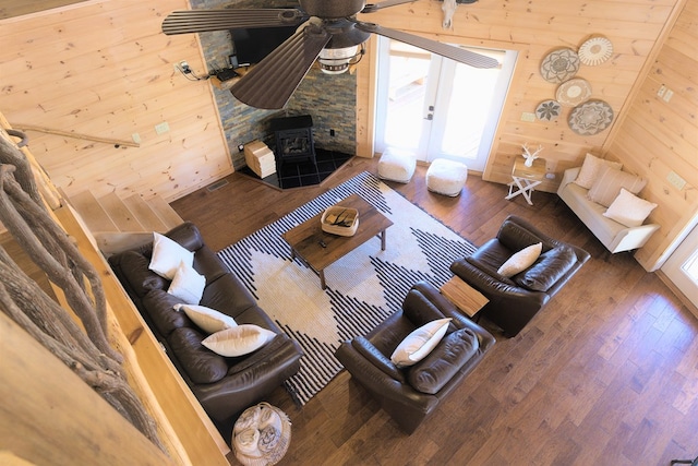 150 Laurel Trce, Blue Ridge, GA 30513 - living room with a wood stove, wooden walls, plenty of natural light, and wood finished floors