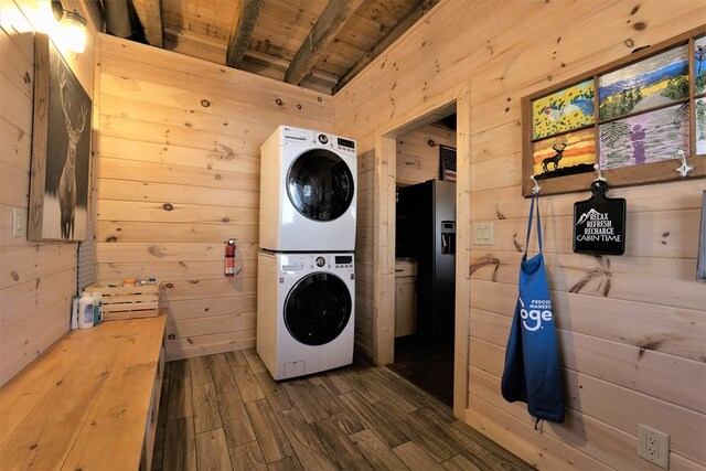 150 Laurel Trce, Blue Ridge, GA 30513 - laundry area with stacked washing machine and dryer, wooden ceiling, wood walls, and dark wood finished floors