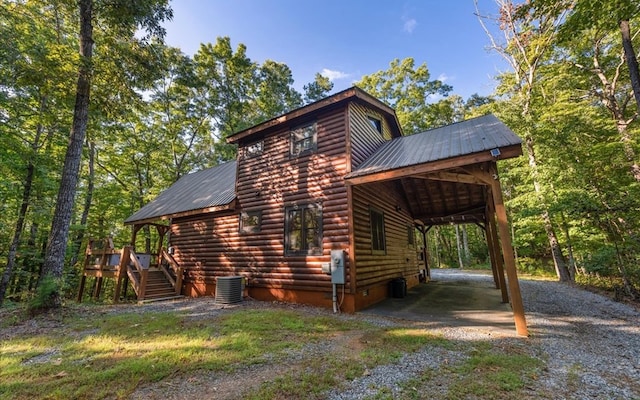 150 Laurel Trce, Blue Ridge, GA 30513 - view of side of home with driveway, metal roof, central air condition unit, and a carport