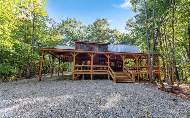150 Laurel Trce, Blue Ridge, GA 30513 - view of front of house with metal roof, a carport, log veneer siding, driveway, and stairway
