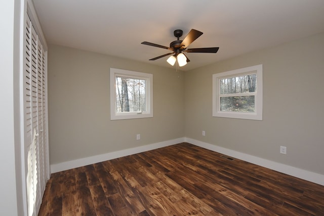 16 Sims Rd, Hiawassee, GA 30546 - spare room with ceiling fan, dark wood-type flooring, visible vents, and baseboards