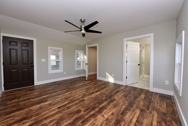 16 Sims Rd, Hiawassee, GA 30546 - unfurnished bedroom featuring dark wood finished floors, visible vents, vaulted ceiling, ceiling fan, and baseboards