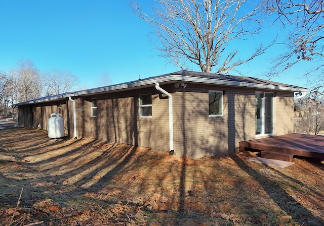 16 Sims Rd, Hiawassee, GA 30546 - view of side of property with a wooden deck and brick siding