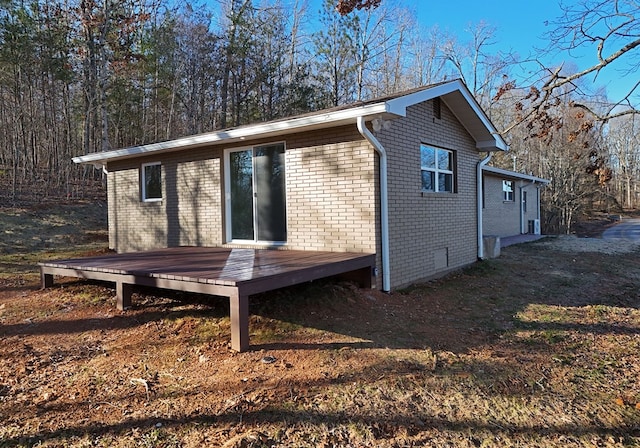 16 Sims Rd, Hiawassee, GA 30546 - view of property exterior featuring a deck and brick siding