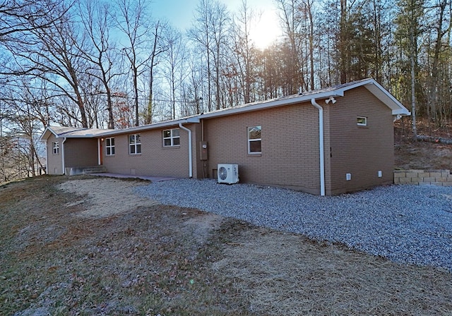 16 Sims Rd, Hiawassee, GA 30546 - back of house at dusk with brick siding and ac unit