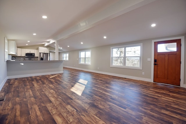 16 Sims Rd, Hiawassee, GA 30546 - unfurnished living room featuring lofted ceiling with beams, baseboards, dark wood finished floors, and recessed lighting