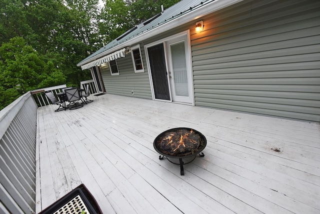 wooden deck featuring outdoor dining area