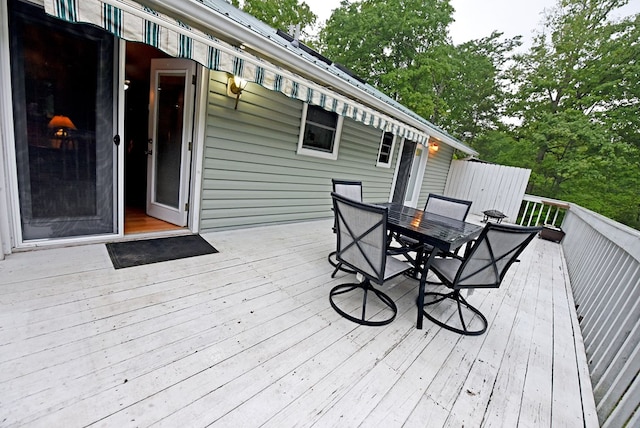 deck with outdoor dining area