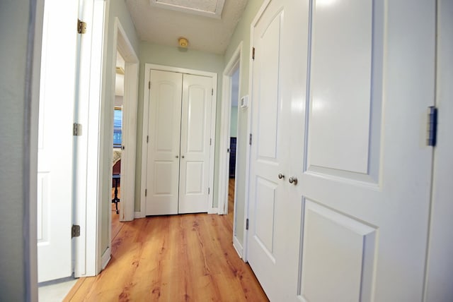 hallway featuring light wood-type flooring