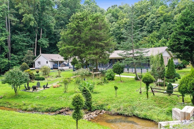 birds eye view of property with a water view