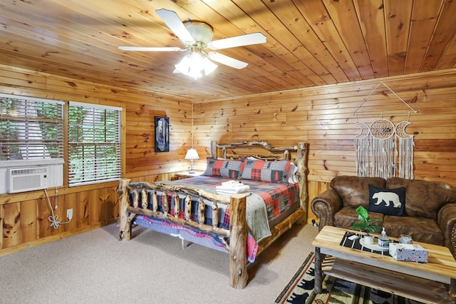 bedroom with wood ceiling, ceiling fan, carpet flooring, and wood walls