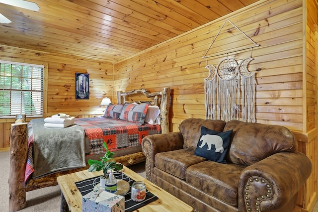 bedroom featuring carpet flooring, wooden ceiling, and wooden walls