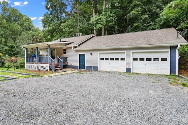 view of front of property featuring a garage and covered porch