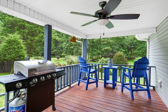 wooden terrace with grilling area and ceiling fan