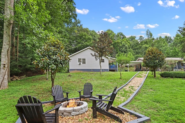 view of yard featuring an outdoor fire pit