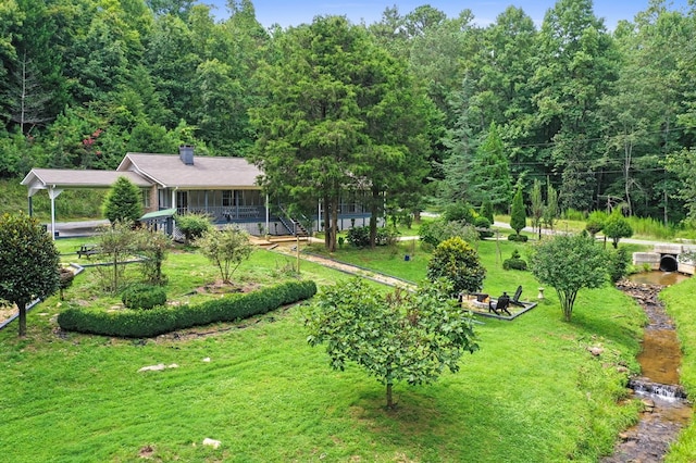 view of yard featuring a porch