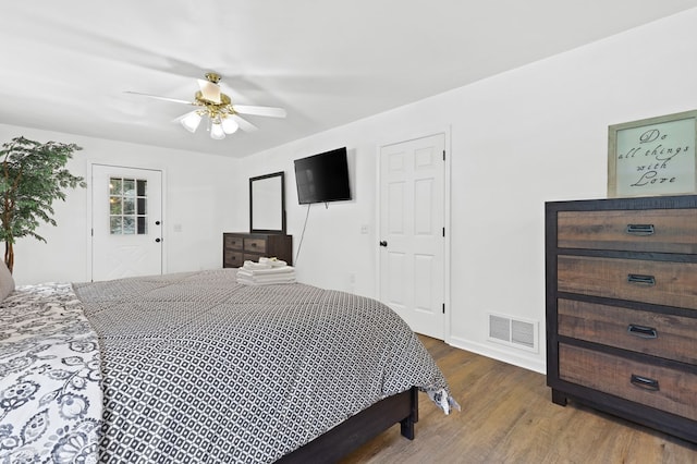 bedroom with wood-type flooring and ceiling fan