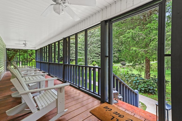 deck with ceiling fan and a porch