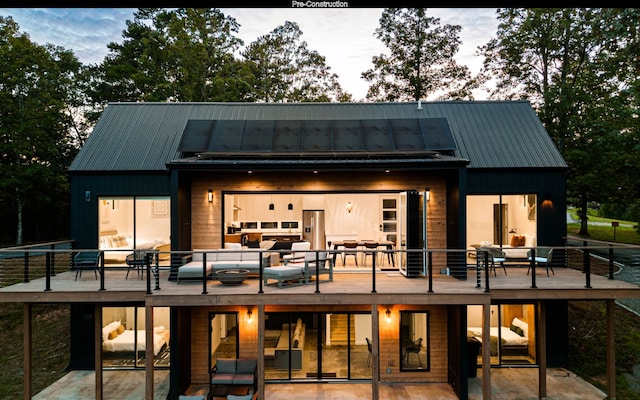 rear view of house featuring outdoor lounge area and a patio