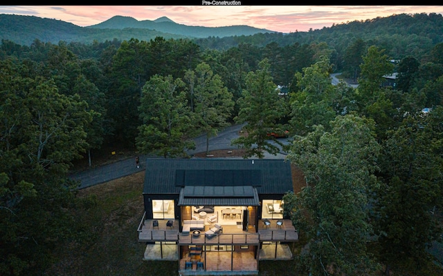 aerial view at dusk with a mountain view