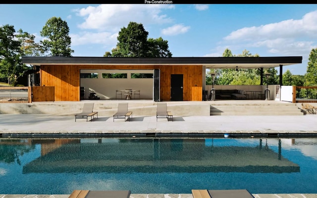 view of swimming pool with a patio area