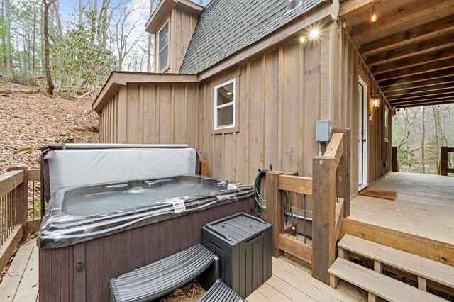 wooden terrace featuring a hot tub