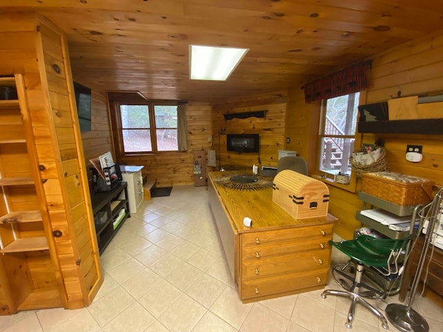 office space with wood ceiling, light tile patterned flooring, and wood walls