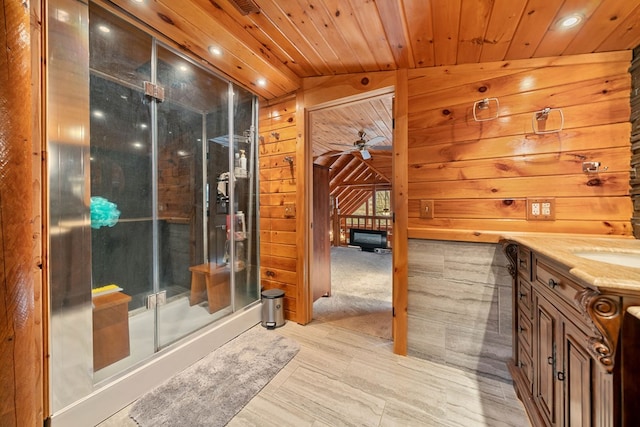 bathroom featuring an enclosed shower, vanity, wooden ceiling, and wood walls