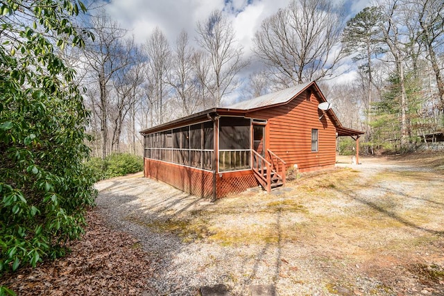 exterior space with a sunroom