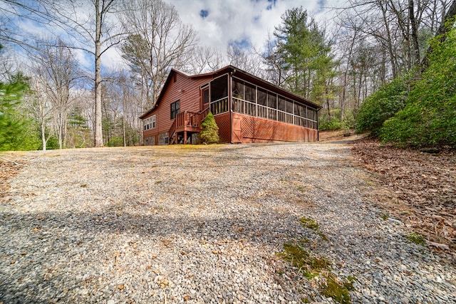 view of home's exterior featuring a sunroom