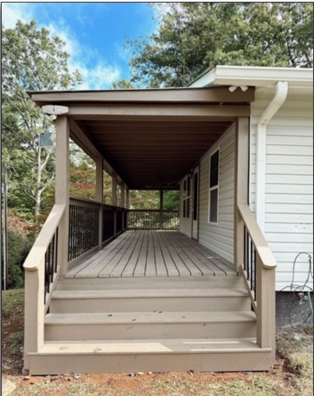 deck with an attached carport