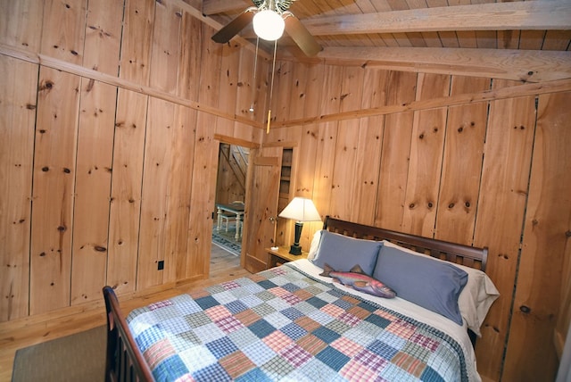 bedroom featuring wood walls, wooden ceiling, beam ceiling, and high vaulted ceiling