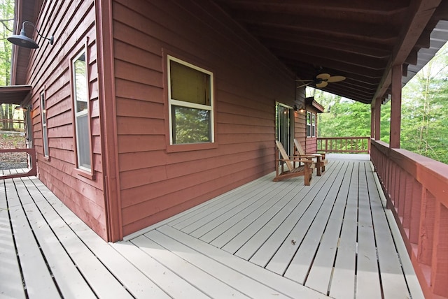 wooden terrace featuring ceiling fan