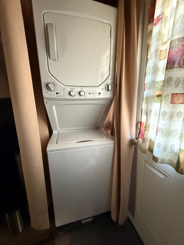 laundry area featuring stacked washer and dryer