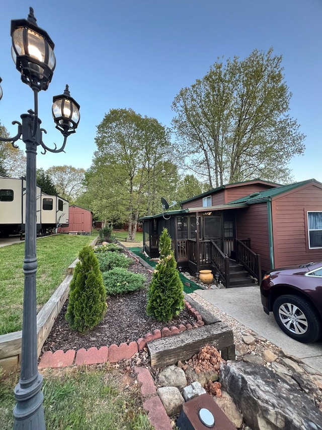 view of yard featuring a sunroom