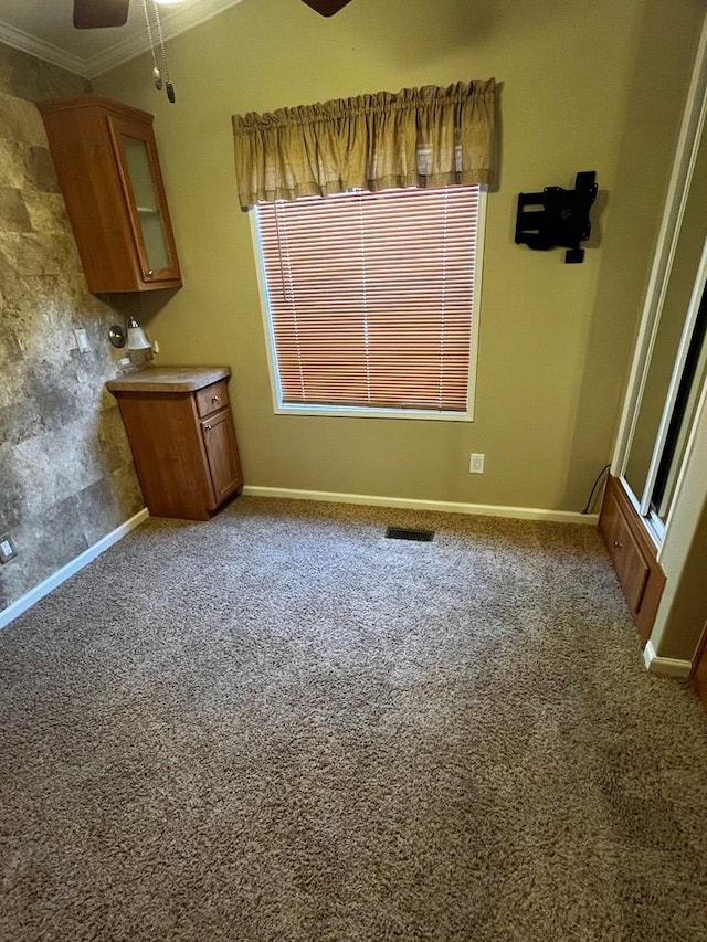 96 Stag Leap Dr, Cleveland, GA 30528 - unfurnished dining area with ceiling fan, ornamental molding, carpet, and baseboards
