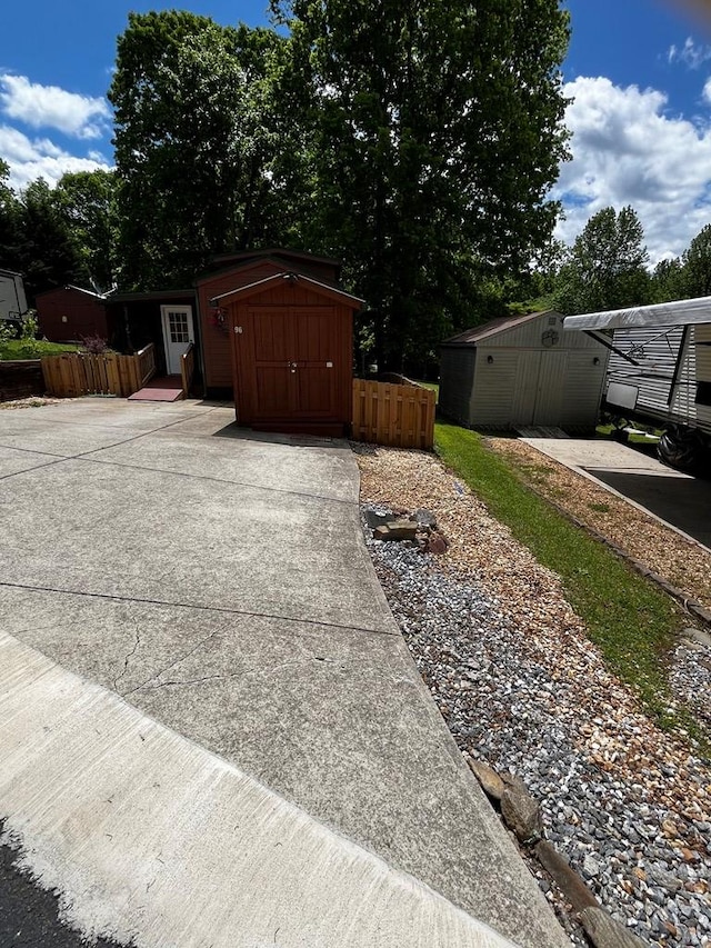 96 Stag Leap Dr, Cleveland, GA 30528 - garage featuring a storage unit and fence