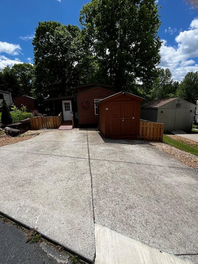 96 Stag Leap Dr, Cleveland, GA 30528 - view of shed with concrete driveway and fence