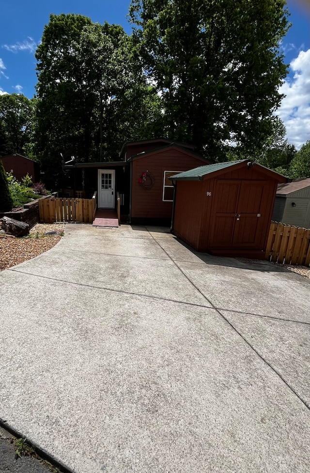 96 Stag Leap Dr, Cleveland, GA 30528 - view of shed with fence and concrete driveway