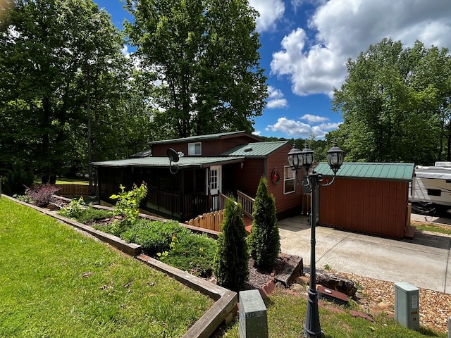 96 Stag Leap Dr, Cleveland, GA 30528 - view of side of property featuring metal roof and a yard
