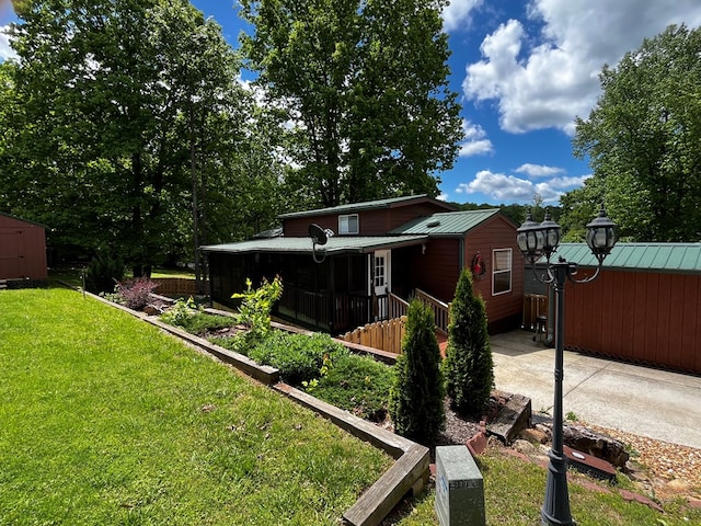 96 Stag Leap Dr, Cleveland, GA 30528 - back of house featuring a yard, a storage shed, an outbuilding, and metal roof