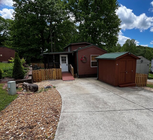 96 Stag Leap Dr, Cleveland, GA 30528 - view of front of property with a storage unit, an outbuilding, and fence